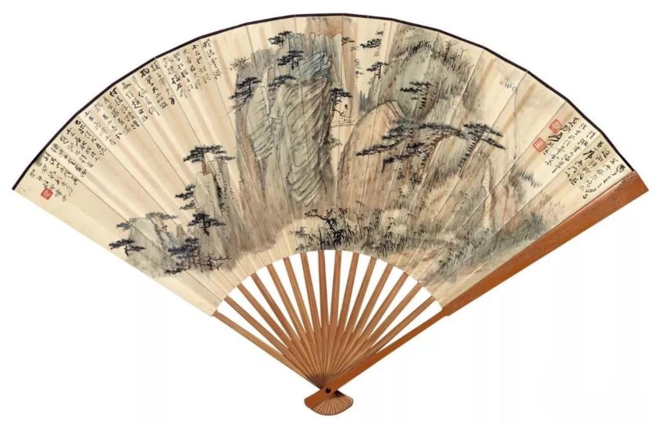 Folding fan depicting mountains with writing and seal marks